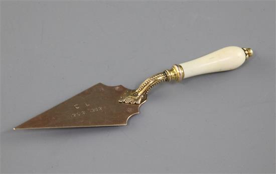 A yellow and gilt metal trowel propelling pencil-cum-letter opener, with ivory handle, retailers and presentation inscription